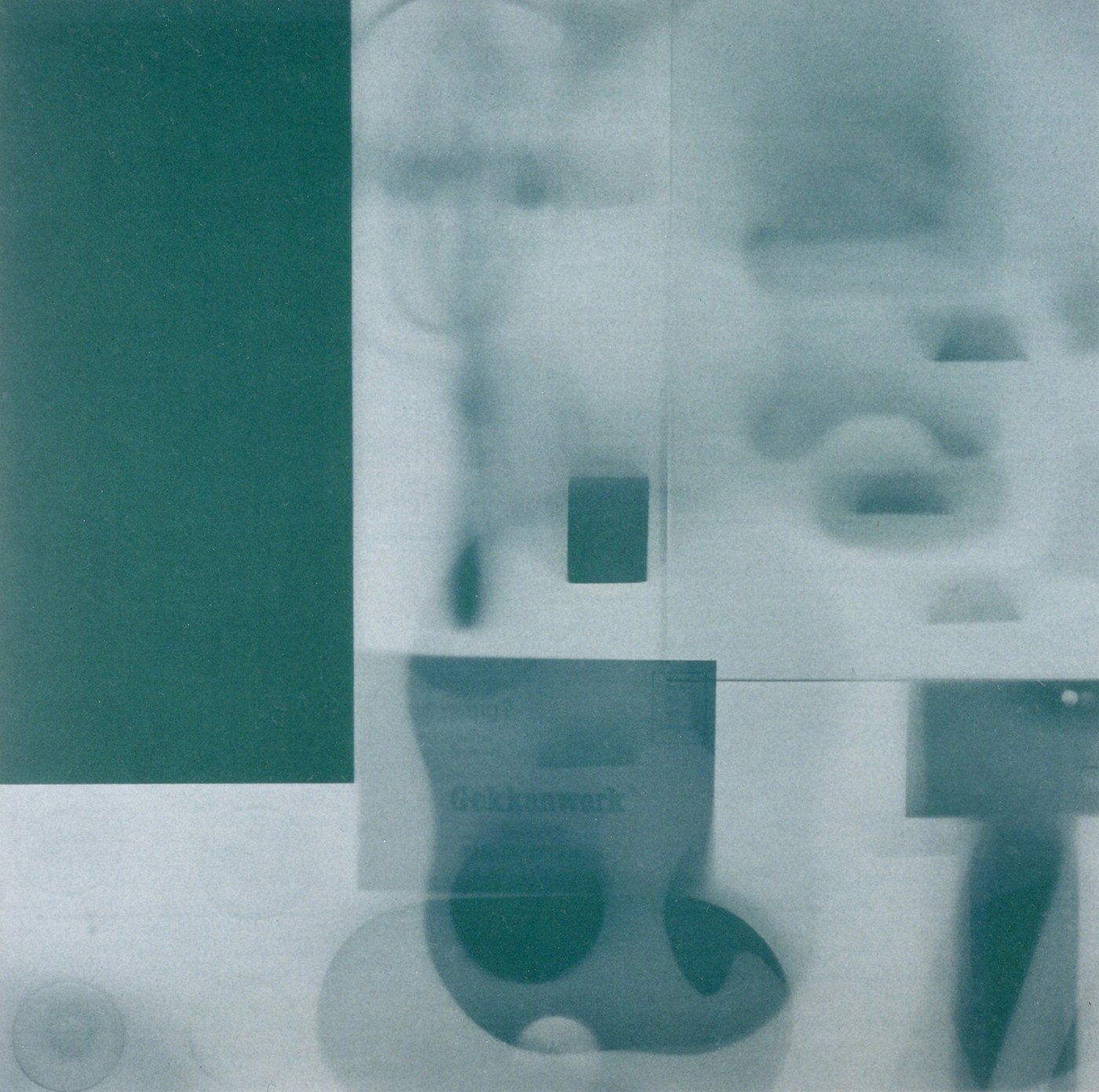 Nomadisch Werkstuk prt D, 1992 - grey-green overlapping panels and soft objects, a dark green band at the left.